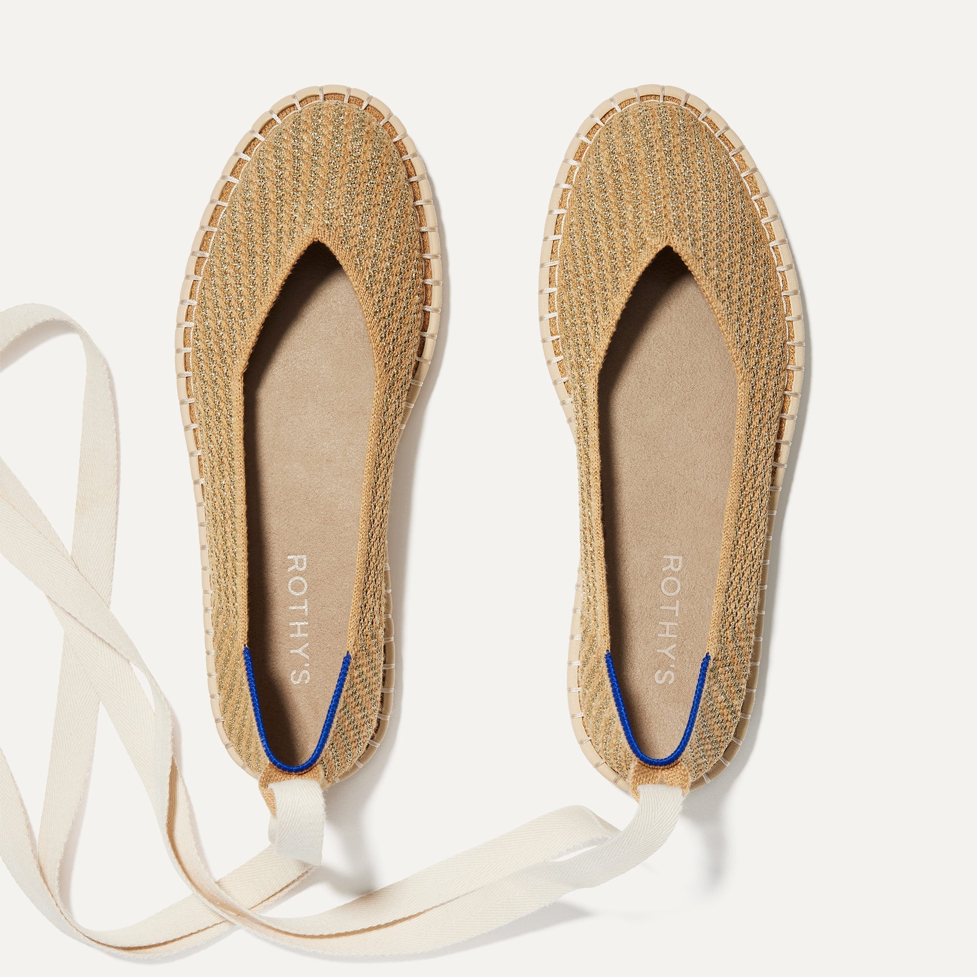 The Espadrille in Gold Stripe shown from the top, with the ankle tie. 