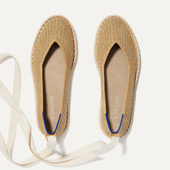The Espadrille in Gold Stripe shown from the top, with the ankle tie. 