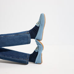 hover | Model wearing The Double Bit Driver in Sky.