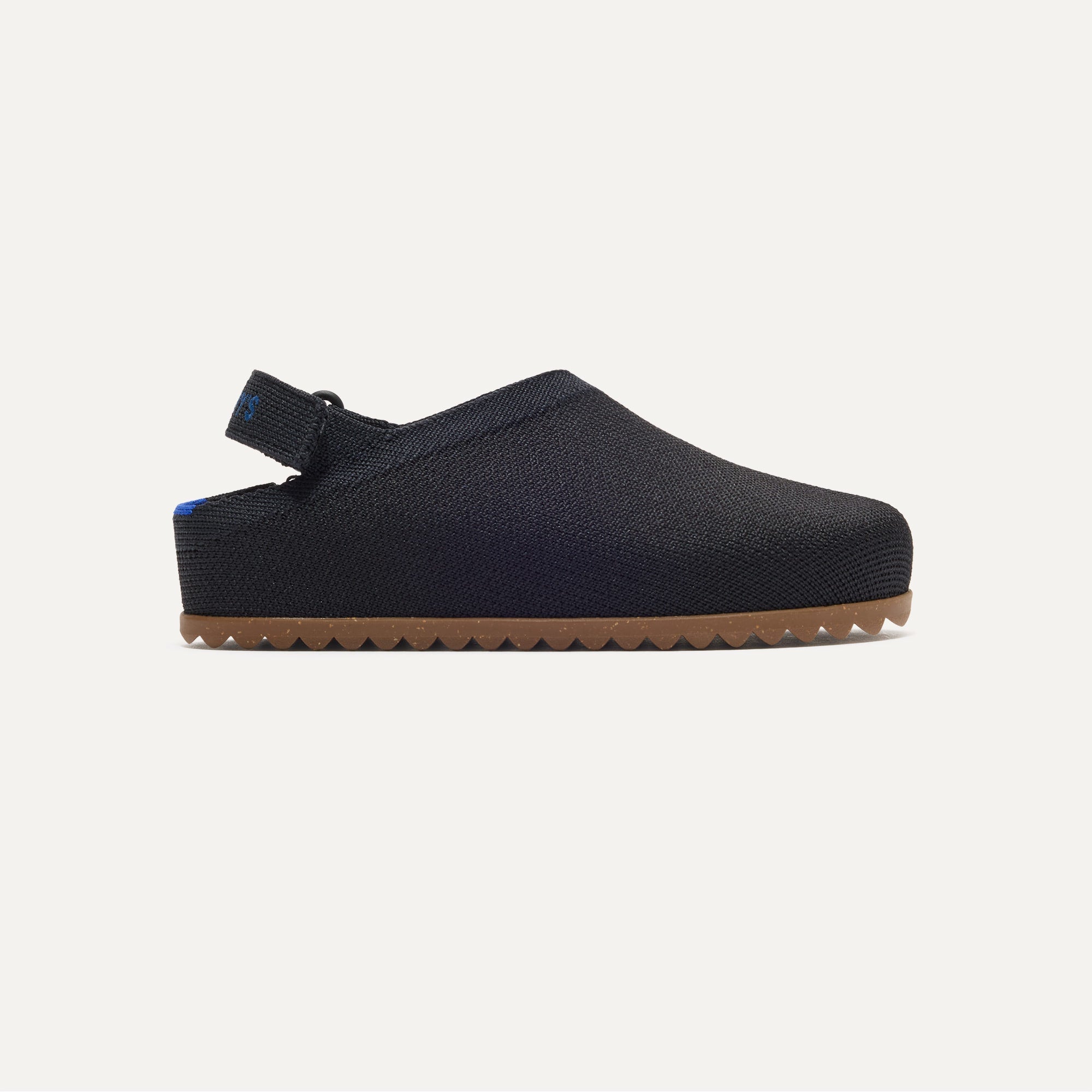 The Kids Clog in Black shown from the side.
