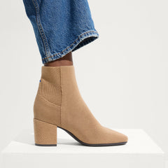 hover | Model wearing The High Classic Boot in Tobacco.