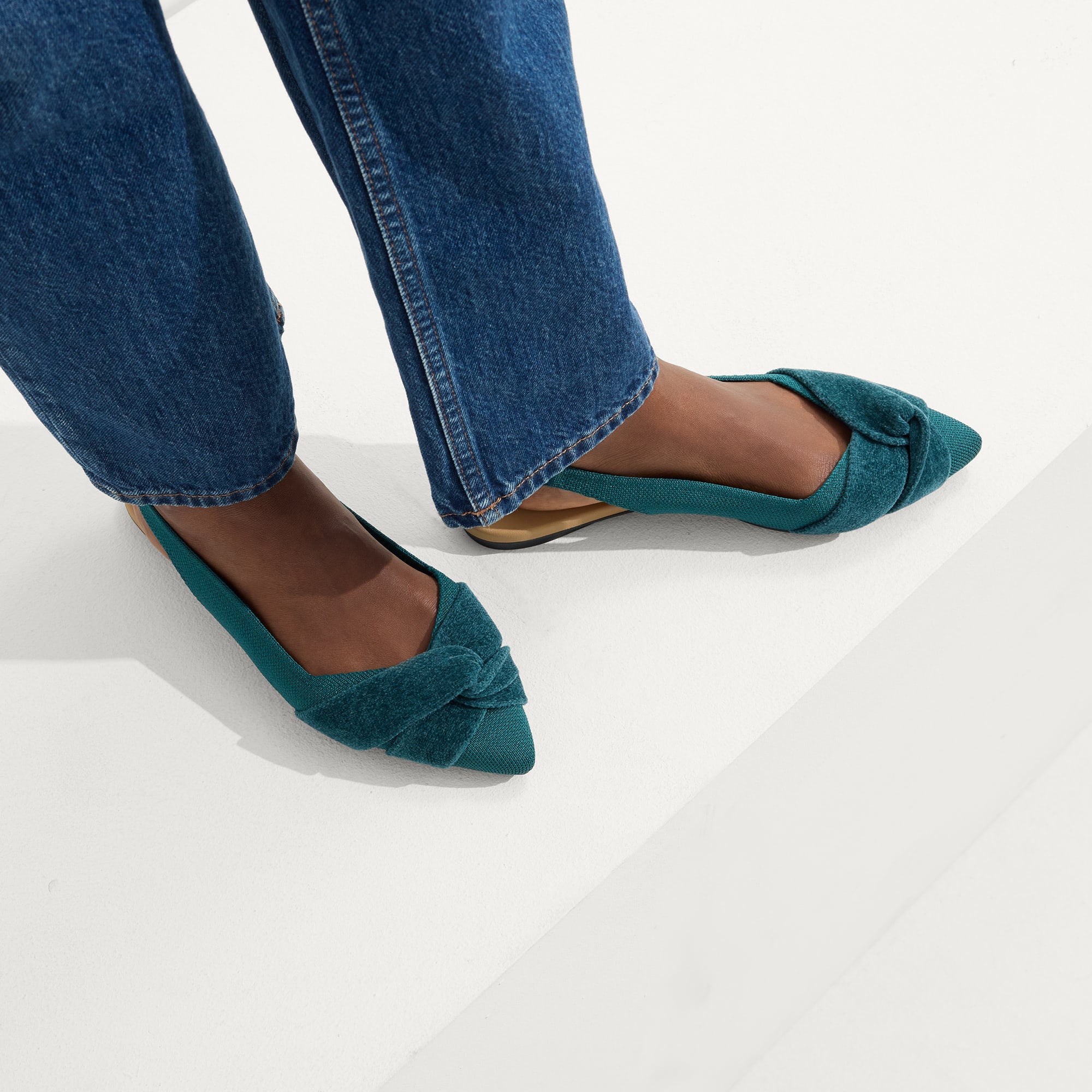 hover | Model wearing The Twist Point Slingback in Everglade.